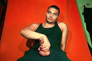 he strokes his exquisite 18cm monster cock on carrot background during guitarjob masturbation session