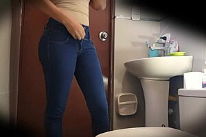 Hidden Camera Captures Curvy Latina's Bathroom Tease