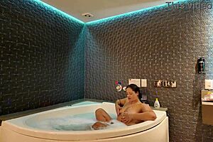 soaking wet in the tub fooling around with hubby's friend while he works 😏💦