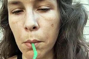 kelly kendricks puffs cigarettes outdoors flashing deep cleavage tease