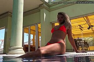 Russian pornstar Mary Kalisy bares small tits poolside