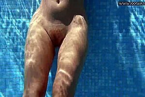 Russian pornstar Mary Kalisy bares small tits poolside