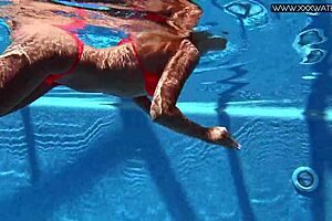 Russian pornstar Mary Kalisy bares small tits poolside