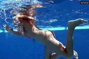 Russian pornstar Mary Kalisy bares small tits poolside