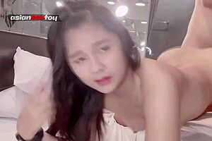 Petite asian smiles cutely during intense doggy fuck