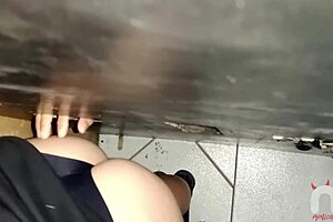 Athletic brunette sucks huge black cock at gloryhole, swallows hot cum