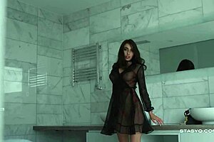 busty russian brunette megan slips into lingerie teasing her big tits from the pool in erotic solo dance