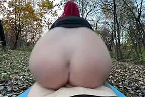 woman caught masturbating publicly by park guard in outdoor scene