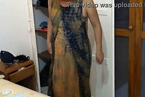 Beach voyeur films mature babe dressing revealing her huge hairy pussy and big tits