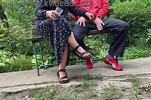 milf jerks huge cock into glass on park bench