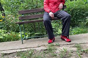 milf jerks huge cock into glass on park bench