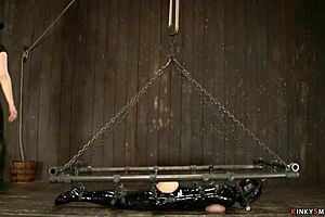 busty milf tied tight in latex for kinky whipping session