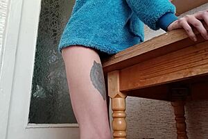 skinny brunette masturbates to orgasm on kitchen countertop