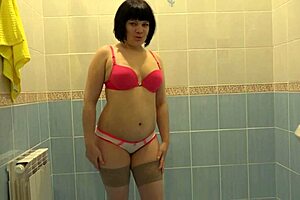 i love watching this cute brunette milf finger her hairy pussy to orgasm in lingerie.