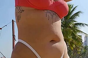 Hey guys i'm filming on the beach flashing to tease all the hot males around